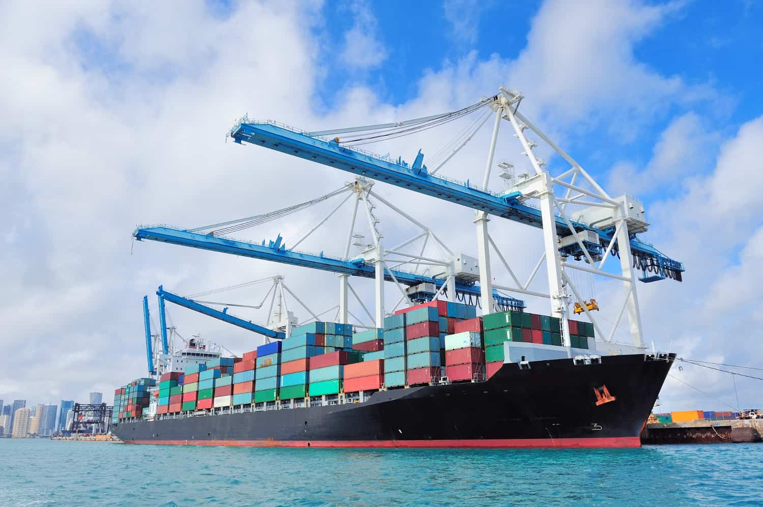 A Cargo ship unloads at PortMiami. (Photo: Shutterstock)