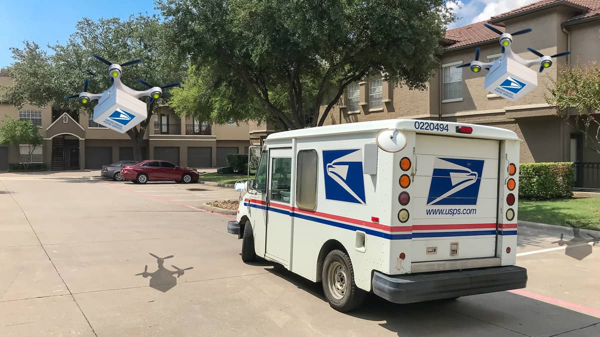 A USPS mail delivery truck is parked on a street.