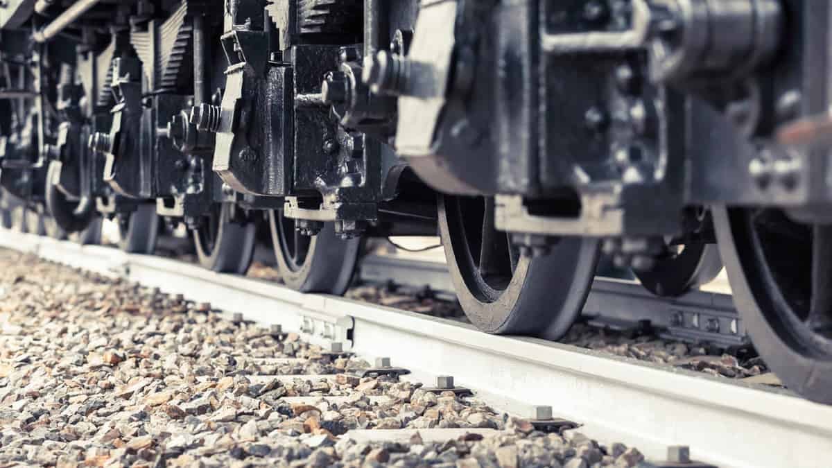 A photograph of railcar wheels on a track.