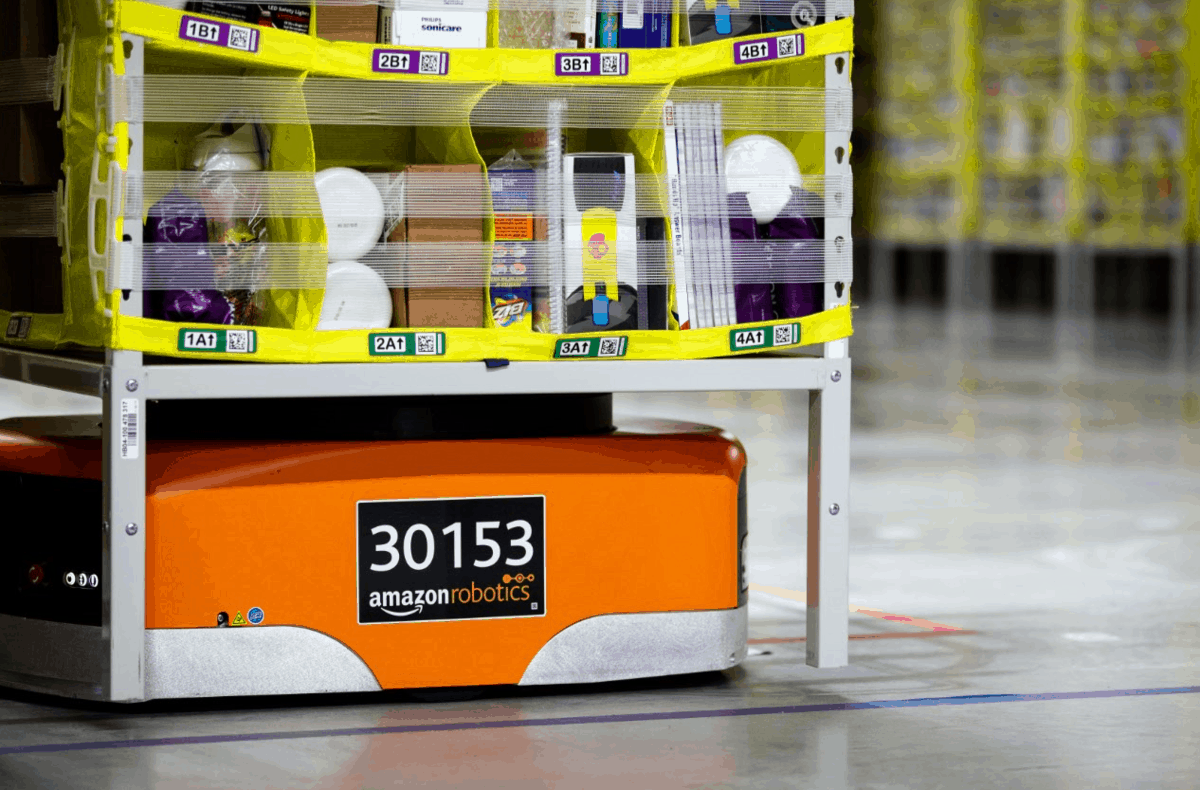 An Amazon Robotics Drive unit moves inventory in a warehouse.