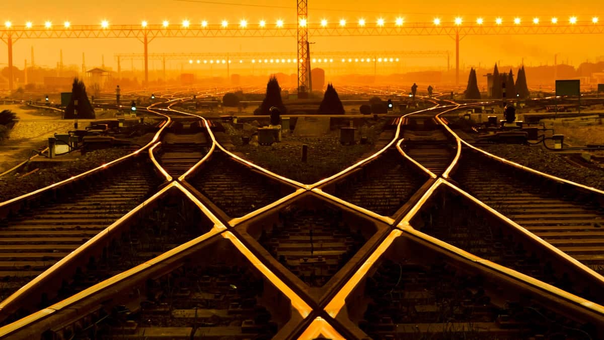 two railroad tracks at sunset