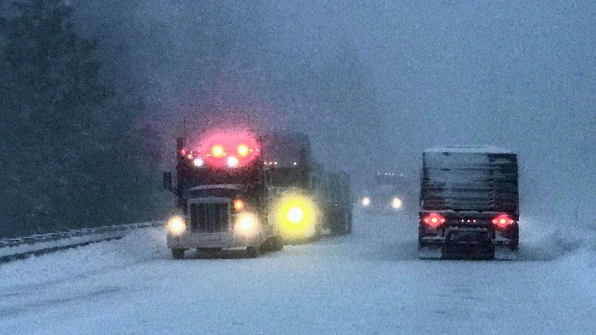 Trucks on snowy road in Washington state.