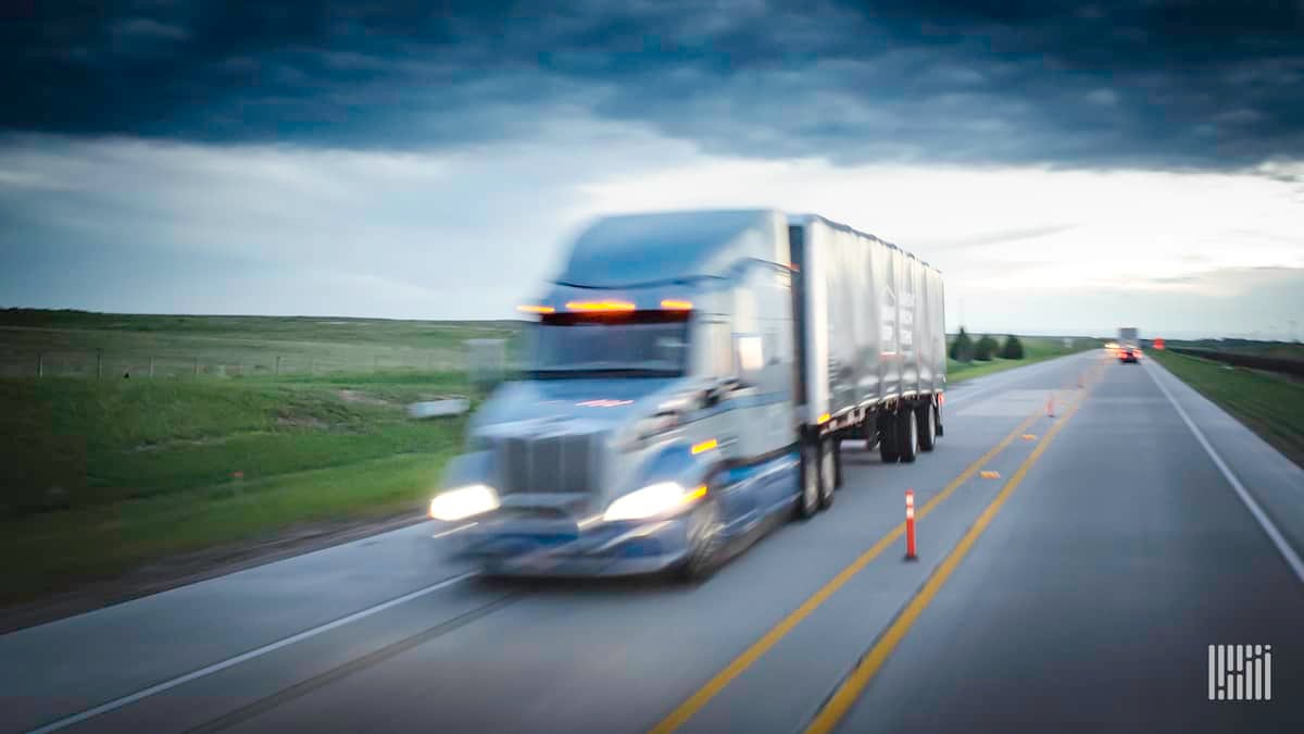 Blurry PACCAR truck on highway