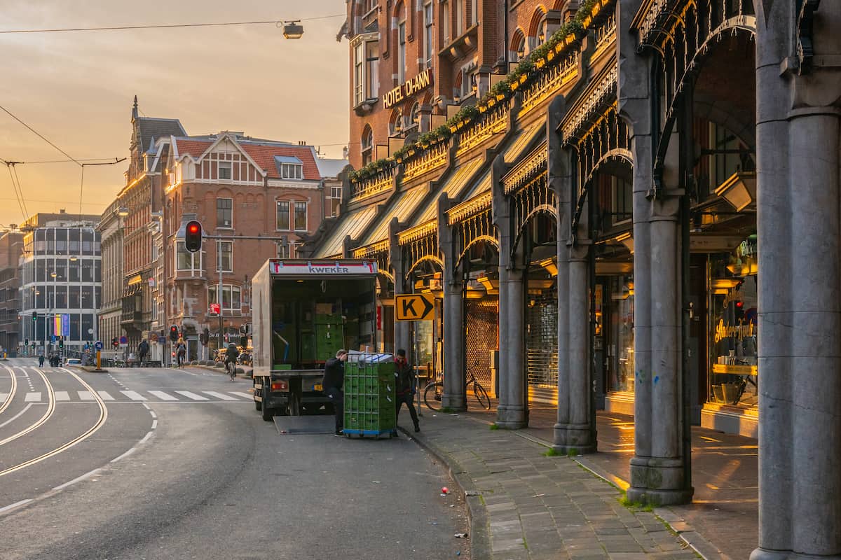 A truck makes a delivery in Amsterdam.