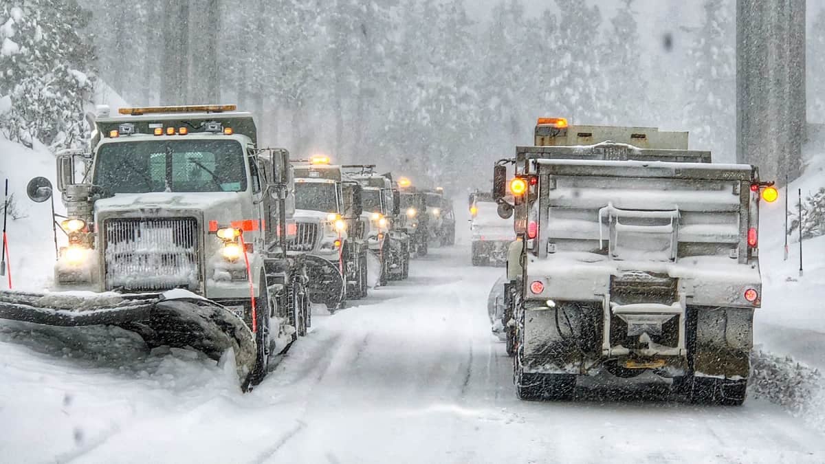 Snowplows clearing a road in California.