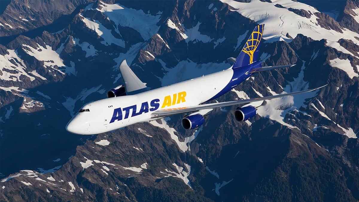 747 jumbo jet flies over mountains