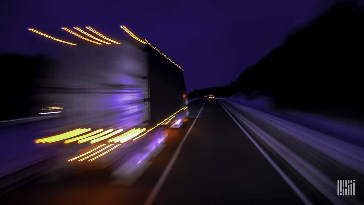 Truck drives through the night