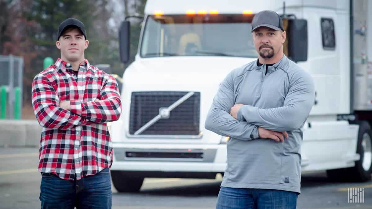 Drivers in front of a truck