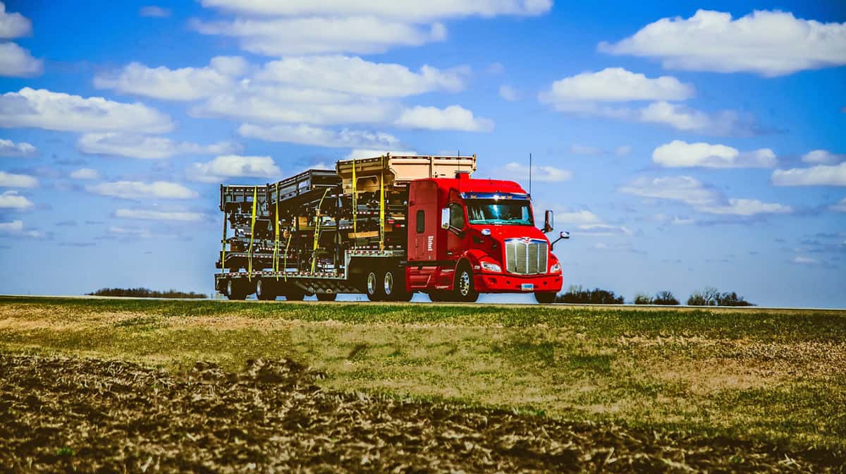 Daseke flatbed on highway