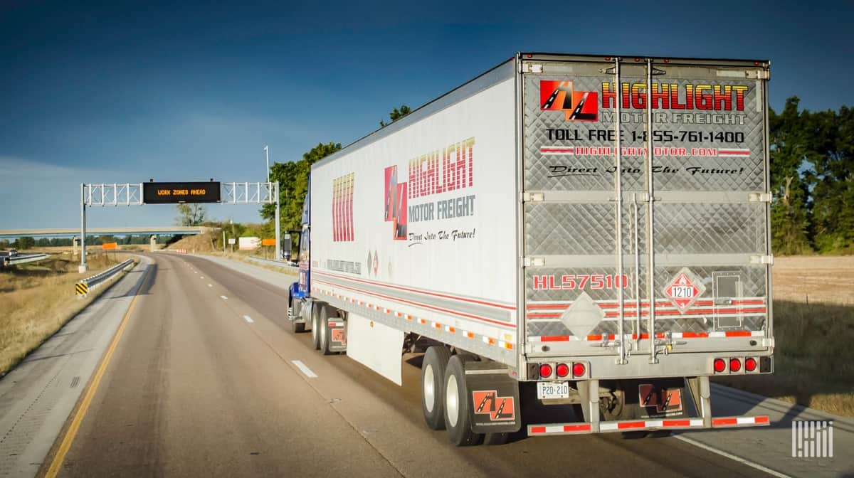 Highlight Motor tractor moving down highway