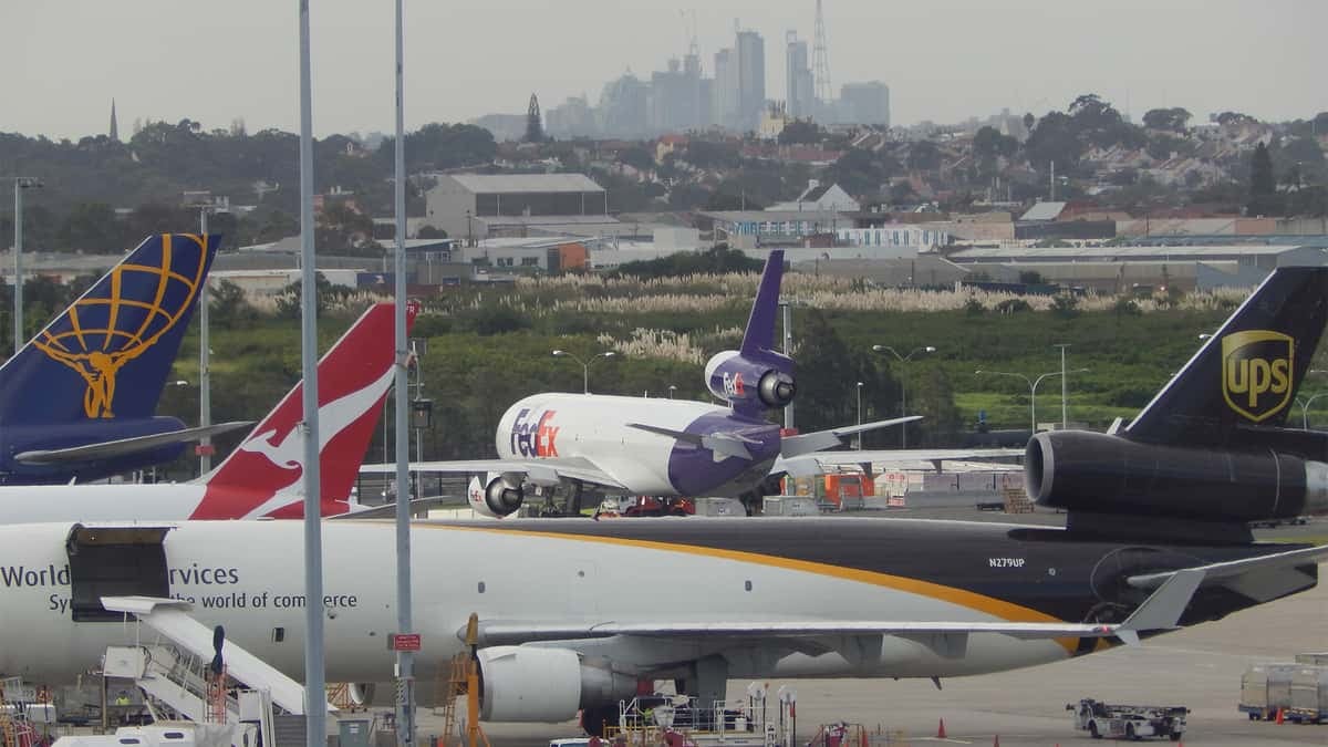 Cargo planes parked at busy airport