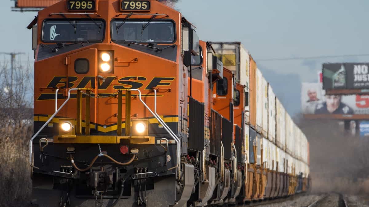 A photograph of locomotive hauling intermodal containers.