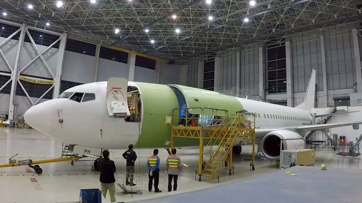 An older Boeing 737 gets ripped up in the shop and modified to carry cargo.