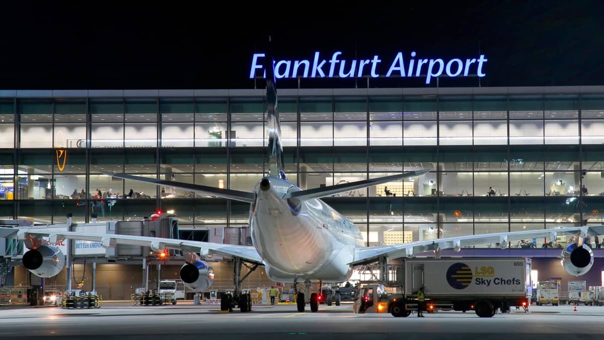 Rear view of plane parked at gate at Frankfurt Airport, nighttime