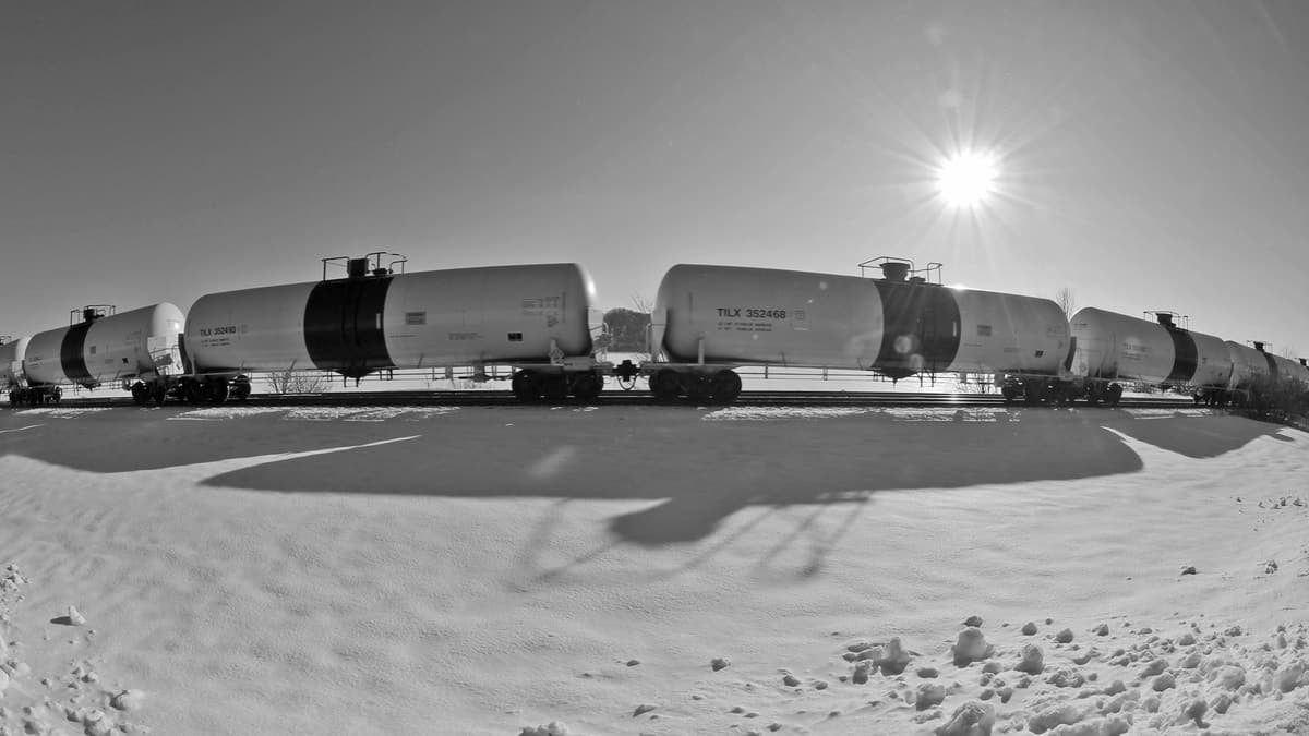 A photograph of four tank cars.