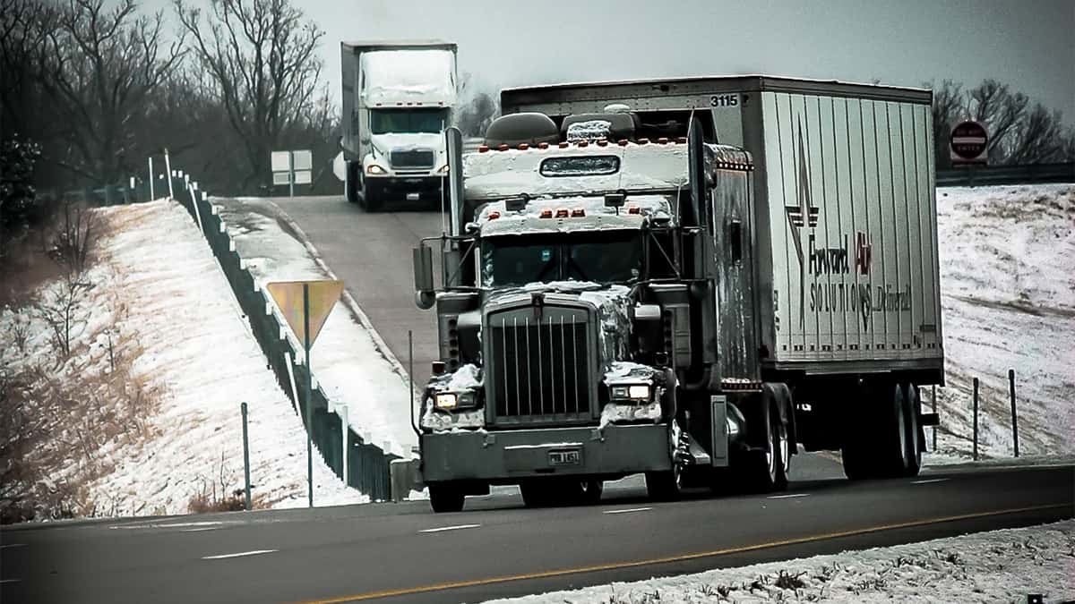 Snow-covered Forward Air truck.