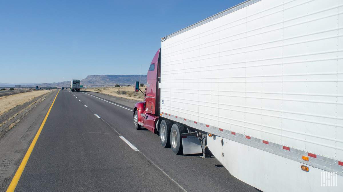 trator trailer headed down highway