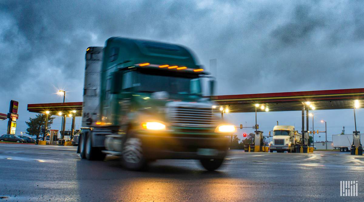 truck pulling out of fuel station