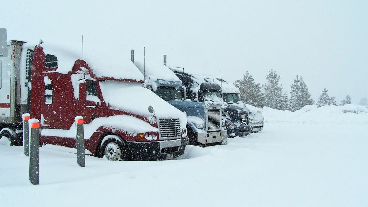 Tractor-trailers stopped at snowy Donner Pass, California.