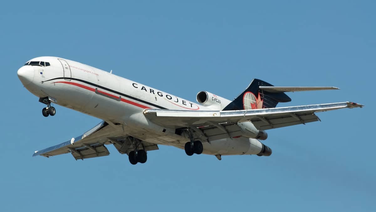 A large white jet on descent to land.