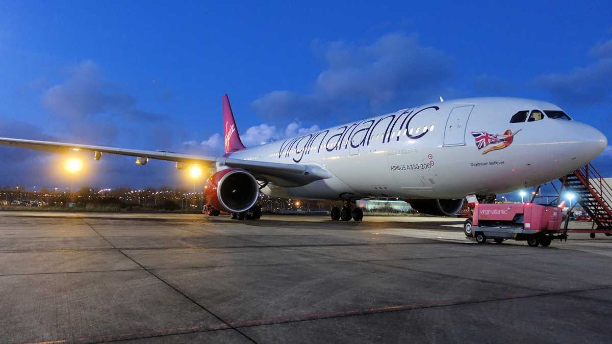 Virgin Atlantic plane on tarmac at night