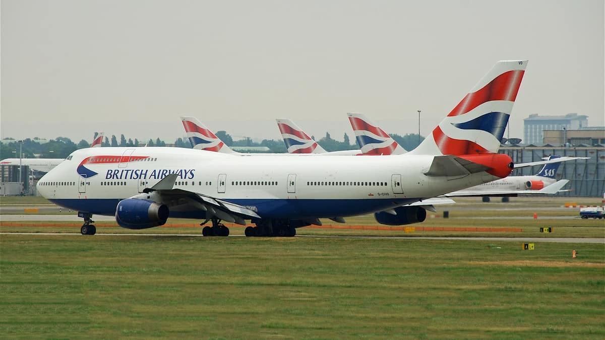 White British Airways jet on runway.