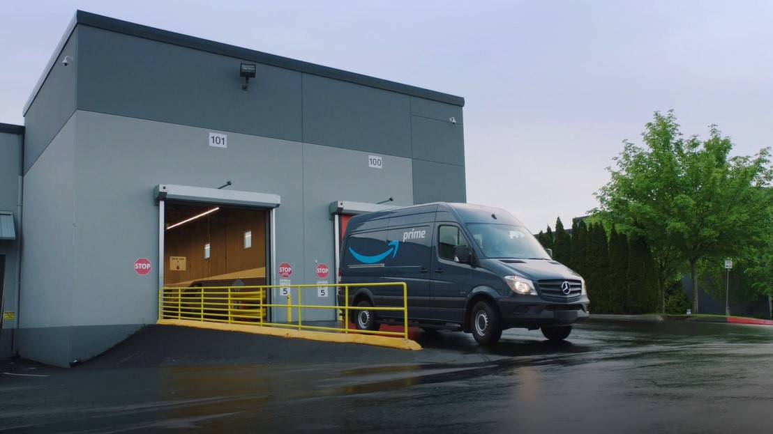 Amazon delivery van leaving fulfillment center