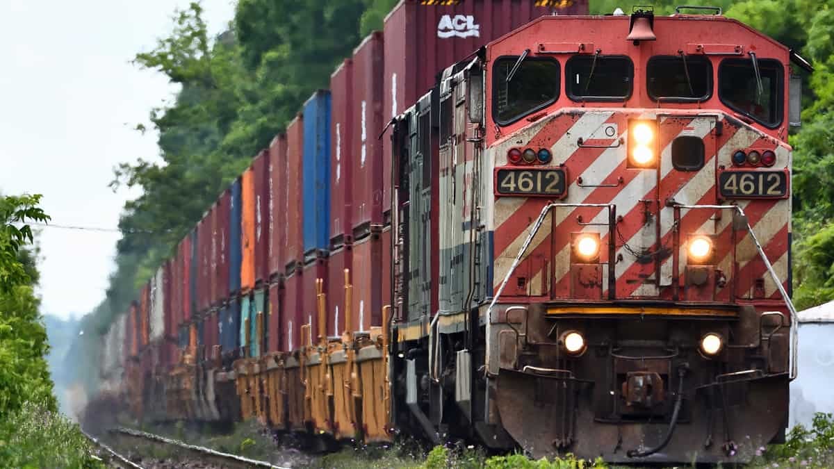 A photograph of a locomotive pulling railcars.