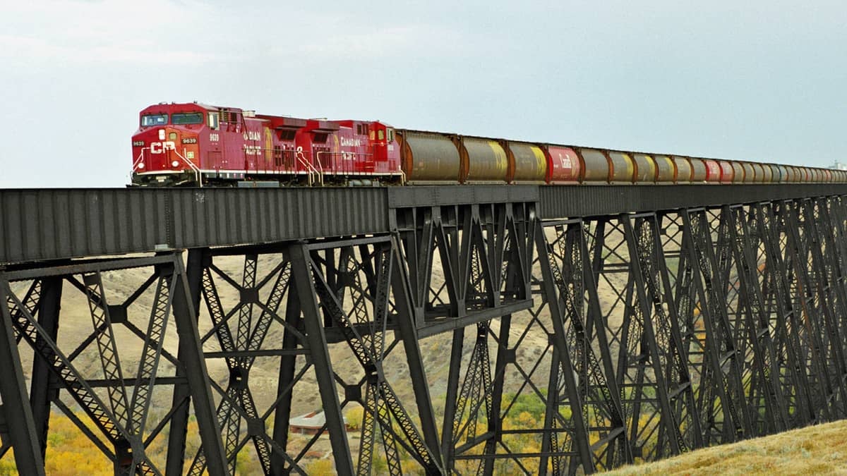 A photograph of a train crossing a bridge.