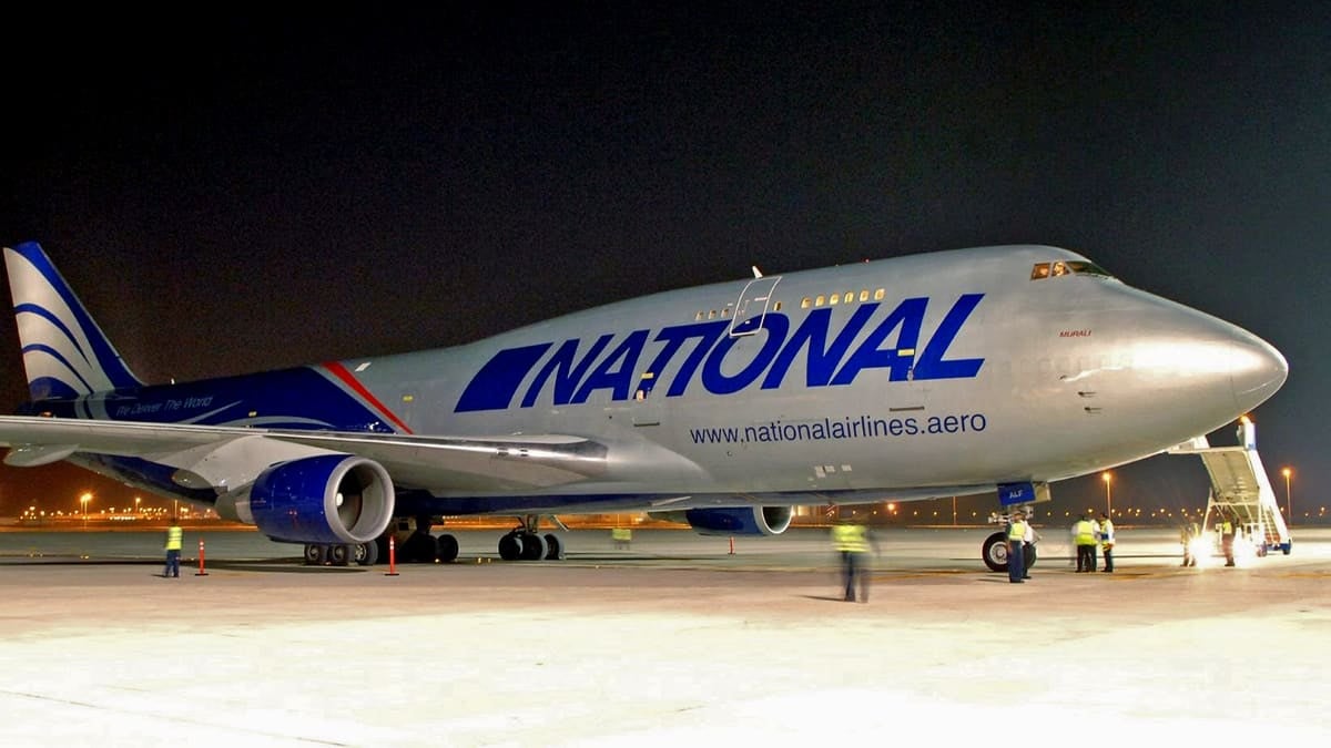 Big jumbo jet freighter on tarmac at night.