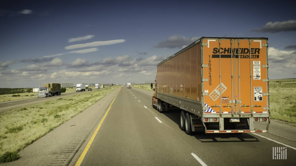 Schneider rig moving down highway