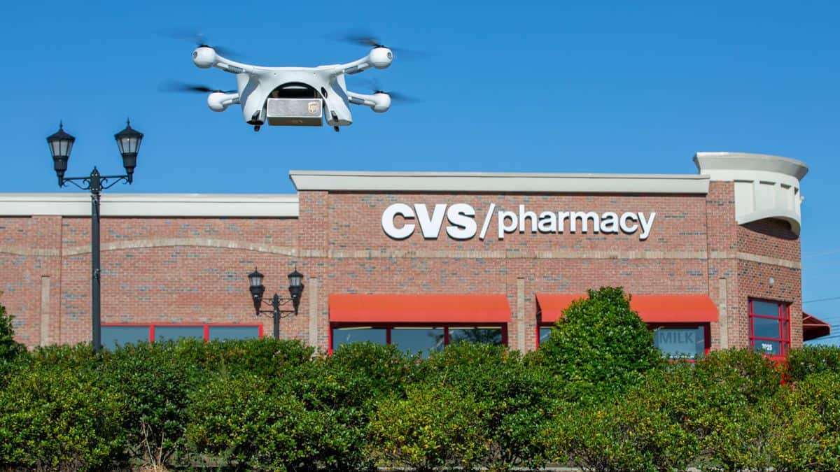 A drone takes off outside a CVS store to make a delivery.