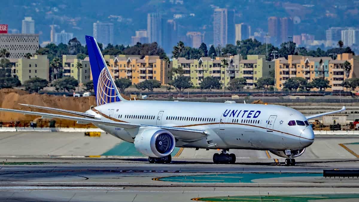 A white-and-blue United jet on the taxiway.