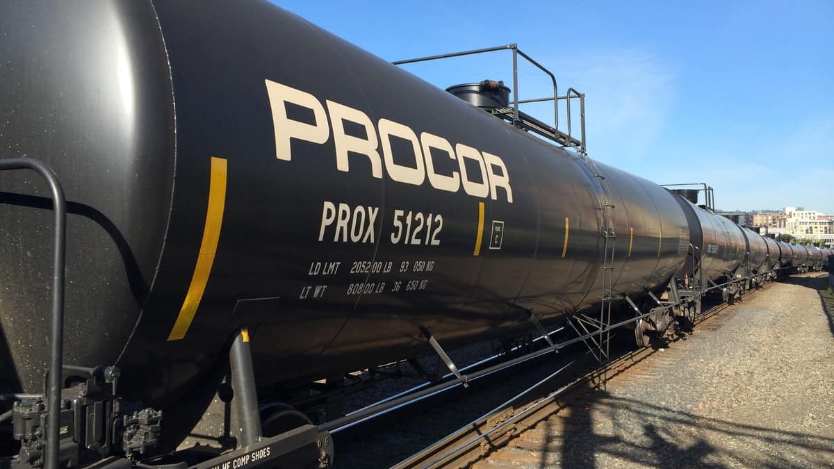 A photograph of a line of tank cars.