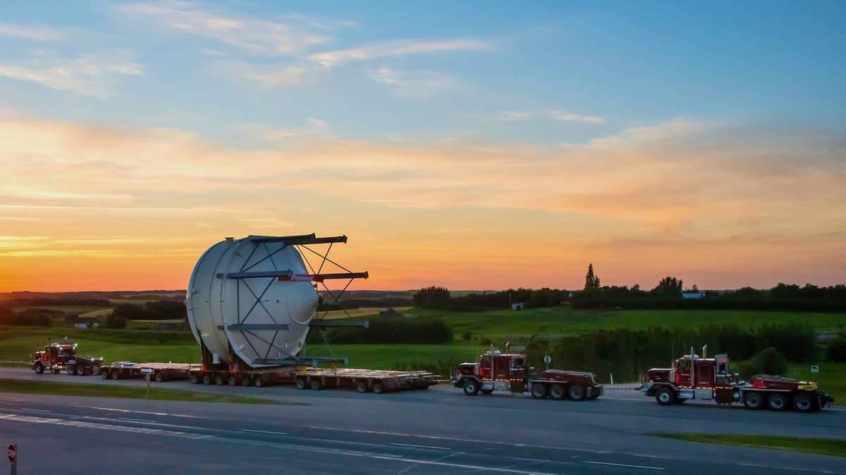 An ENTREC truck transports an oversized piece of equipment