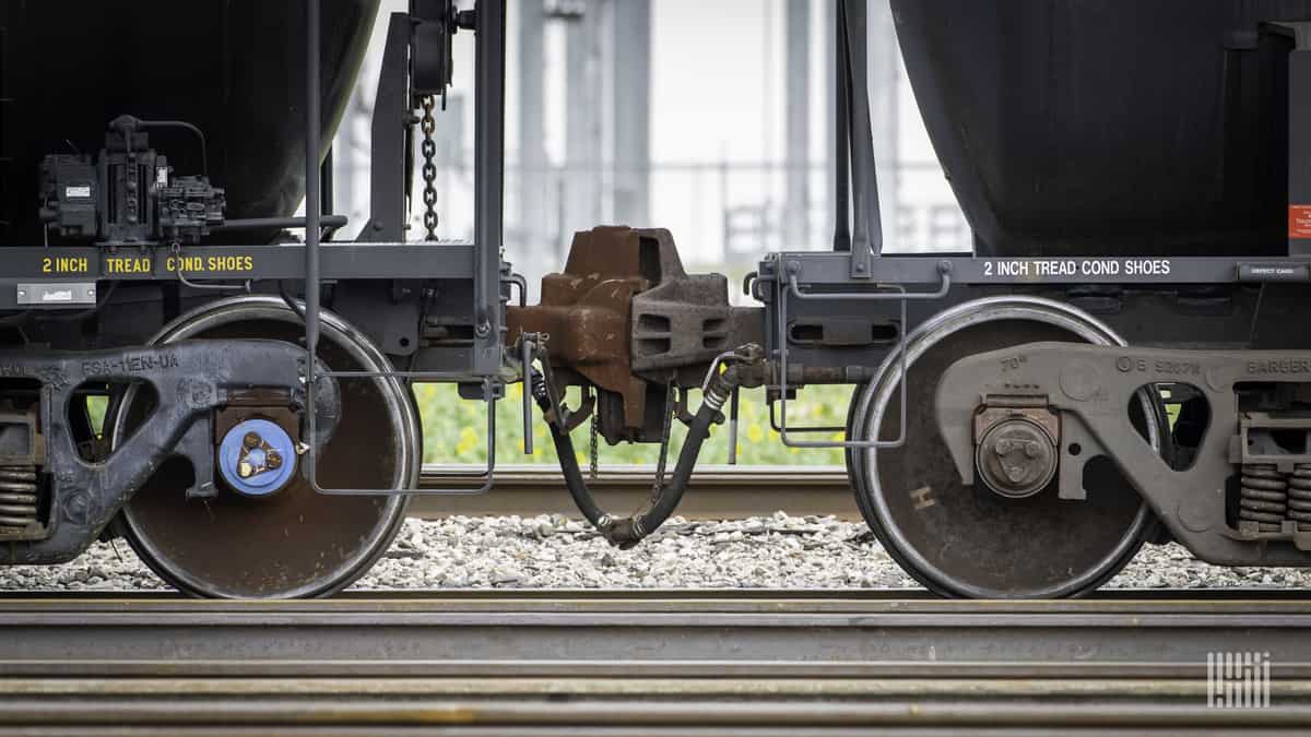 A photograph of two railcars coupled together.