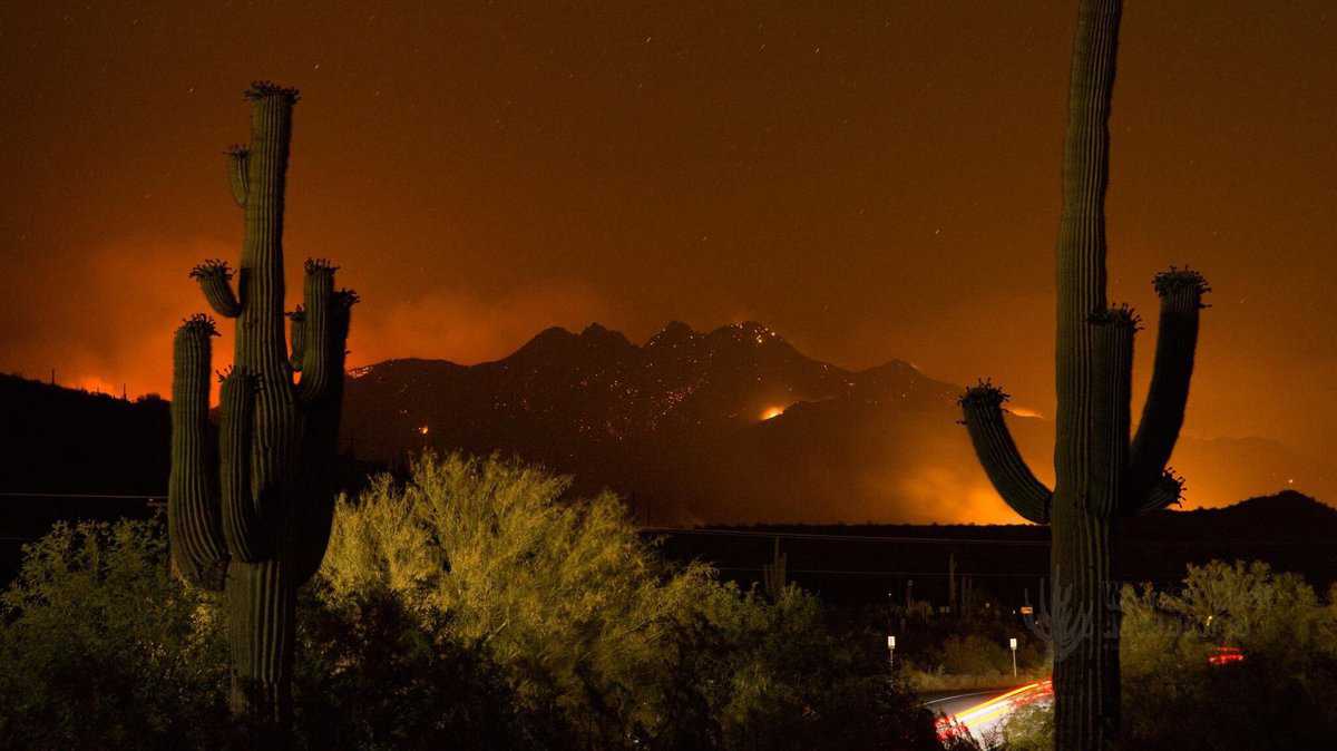 Bush Fire burns the Four Corners landmark in the Tonto National Forest near Phoenix, Arizona.