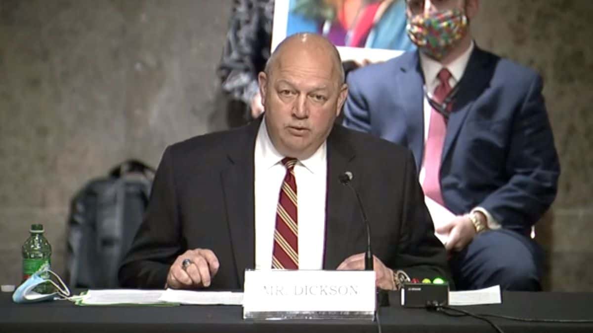 Large bald man, the head of the FAA, speaks before congressional committee.