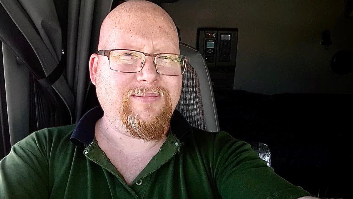 Canadian truck driver Randy James Ulch, pictured in the cab of his truck, believes its important to stand against racism as a white person