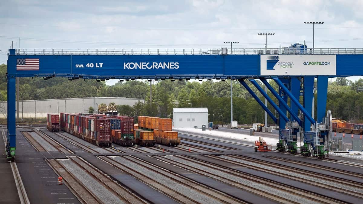 A photograph of containers at a rail yard.