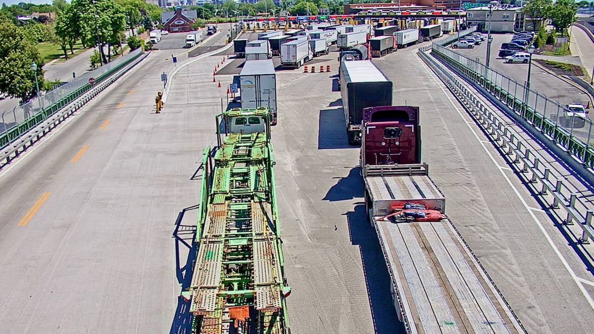 Trucks wait to cross the US-Canada border at a Canada Border Services Agency checkpoint.