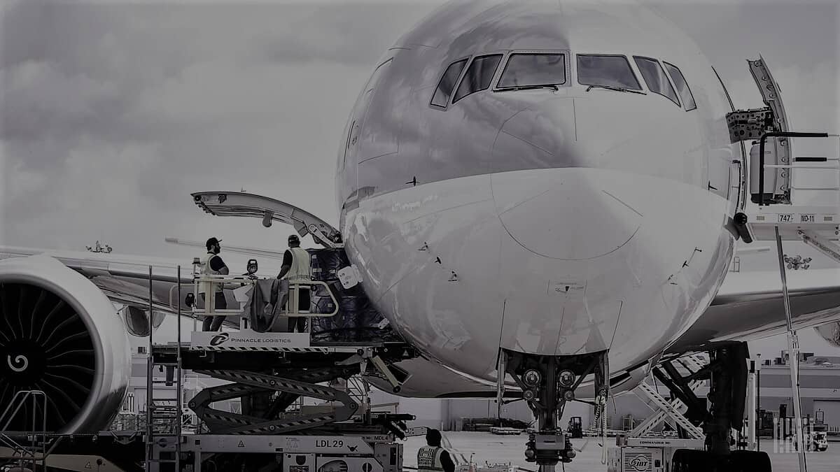 Black and white cargo plane in loading process