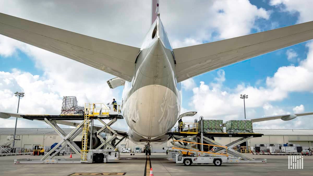 Flight preparations as viewed from behind and below the tail of a big jetliner.