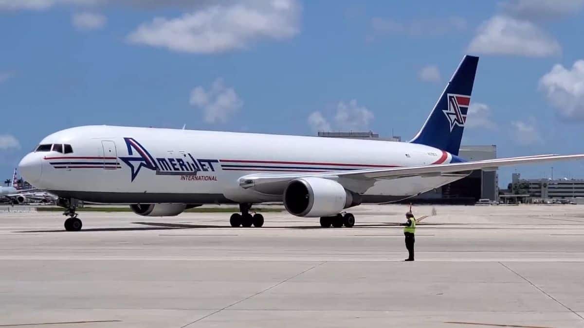 A white Amerijet cargo plane with blue tail. Tim Strauss from Air Canada is the new CEO.