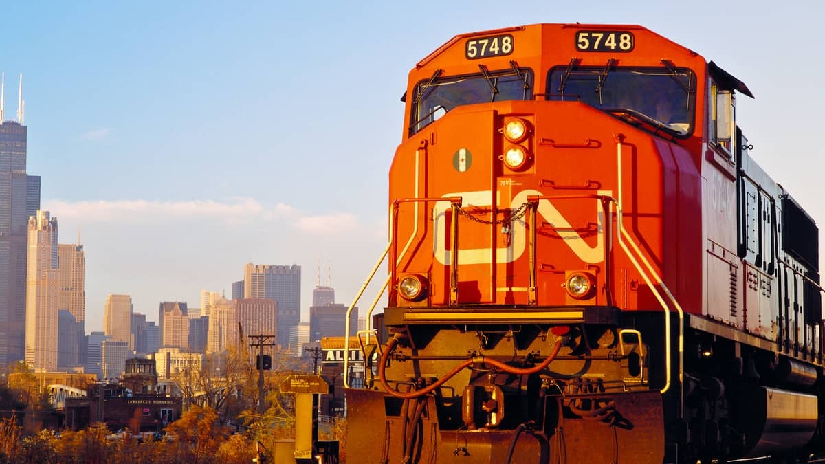 A photograph of a CN train heading away from a city.