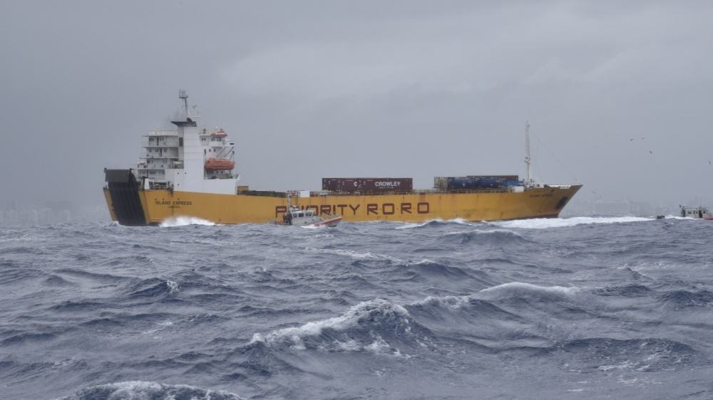 U.S. Coast Guard boat assisting the Island Express cargo ship off the coast of Puerto Rico.