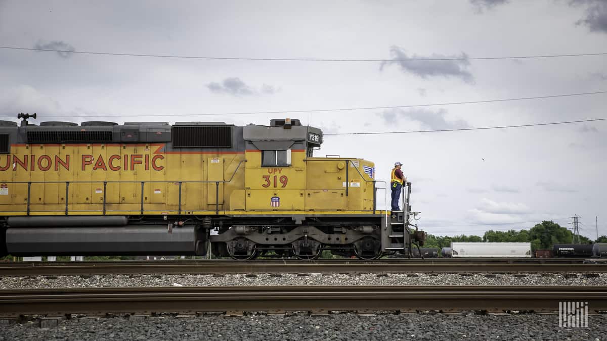 A photograph of a Union Pacific train on a train track.