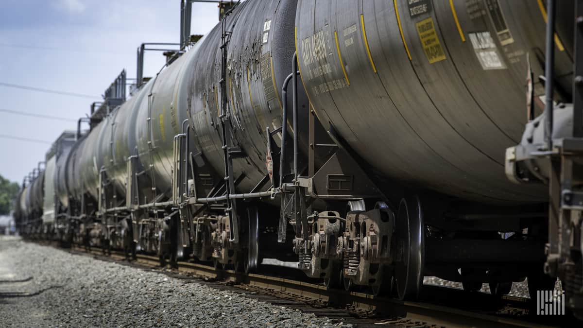 A photograph of a train consisting of tank cars imprinted with GATX's name.