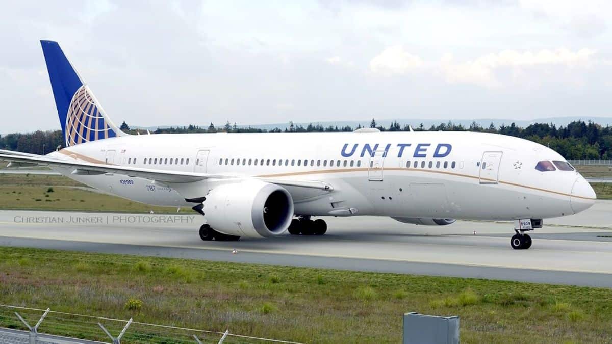 Big United plane on tarmac, side view close up.