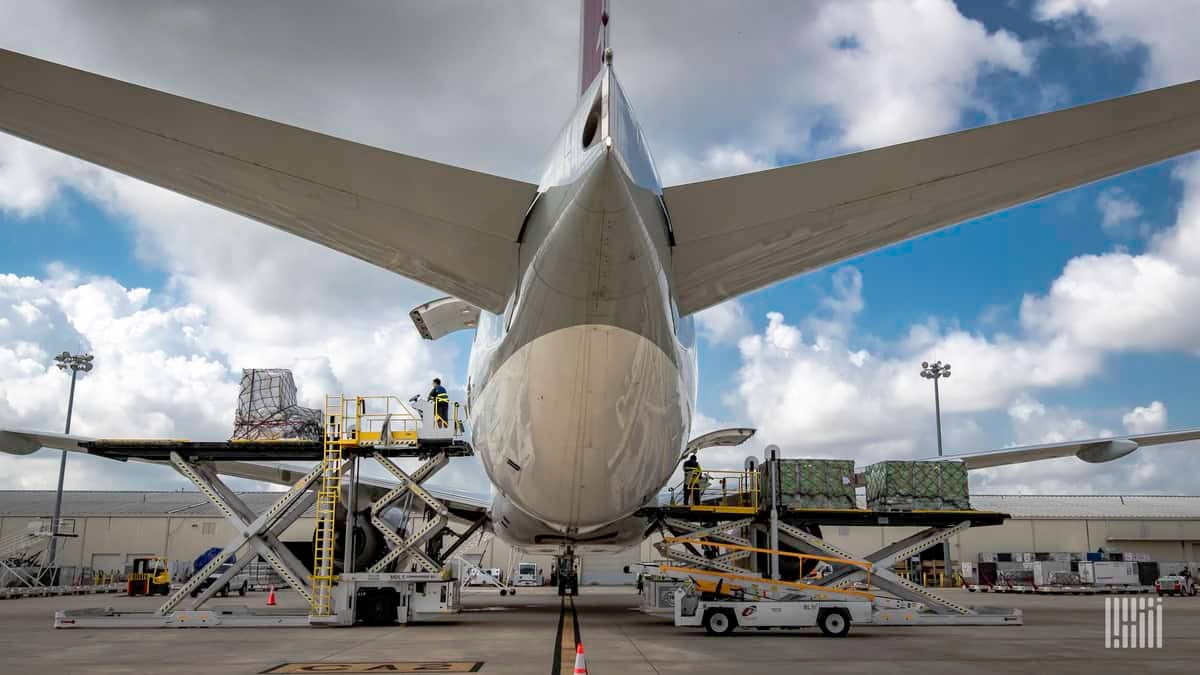 Cargo loading on a big jet as viewed from behind the tail, close up.